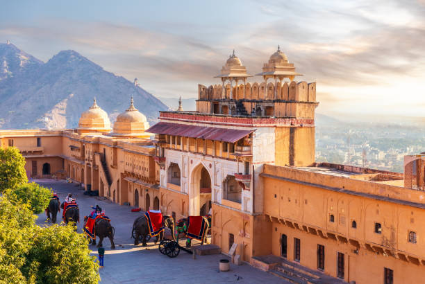 Elephant riders in Amber Fort, famous tourist attraction of Jaipur, India.
